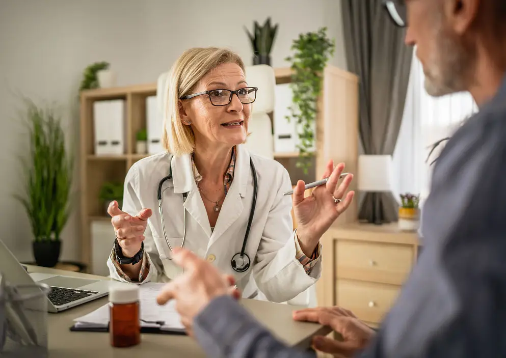Photo of a healthcare provider speaking with a patient