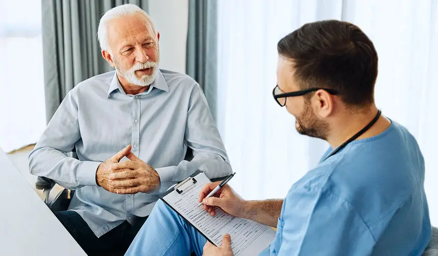 Photo of a man speaking with a healthcare provider